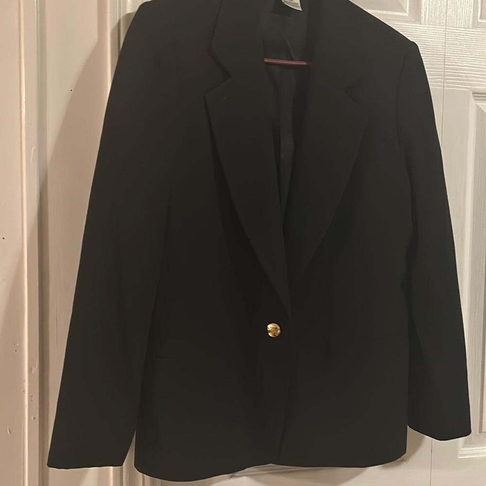 Black petite sportcoat with 2 pockets. Gold  buttons, size 12.